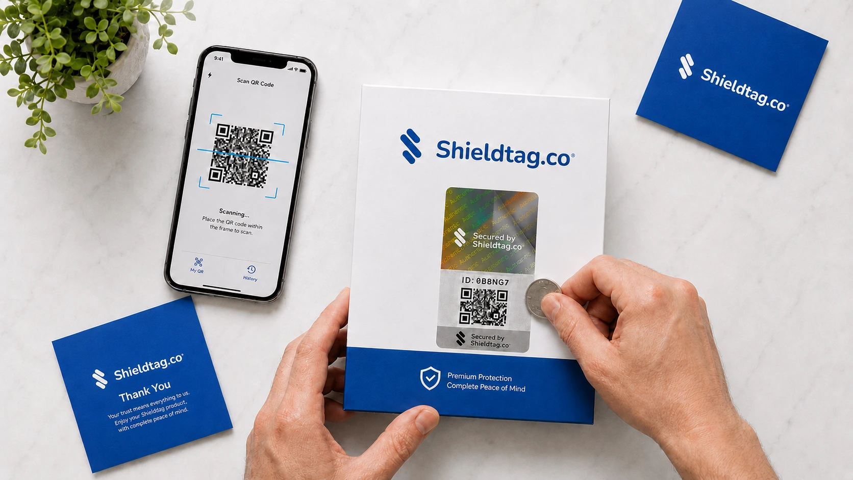 Tangan konsumen memegang smartphone untuk scan QR code stiker Shieldtag pada produk sebagai bagian dari program Scratch and Win